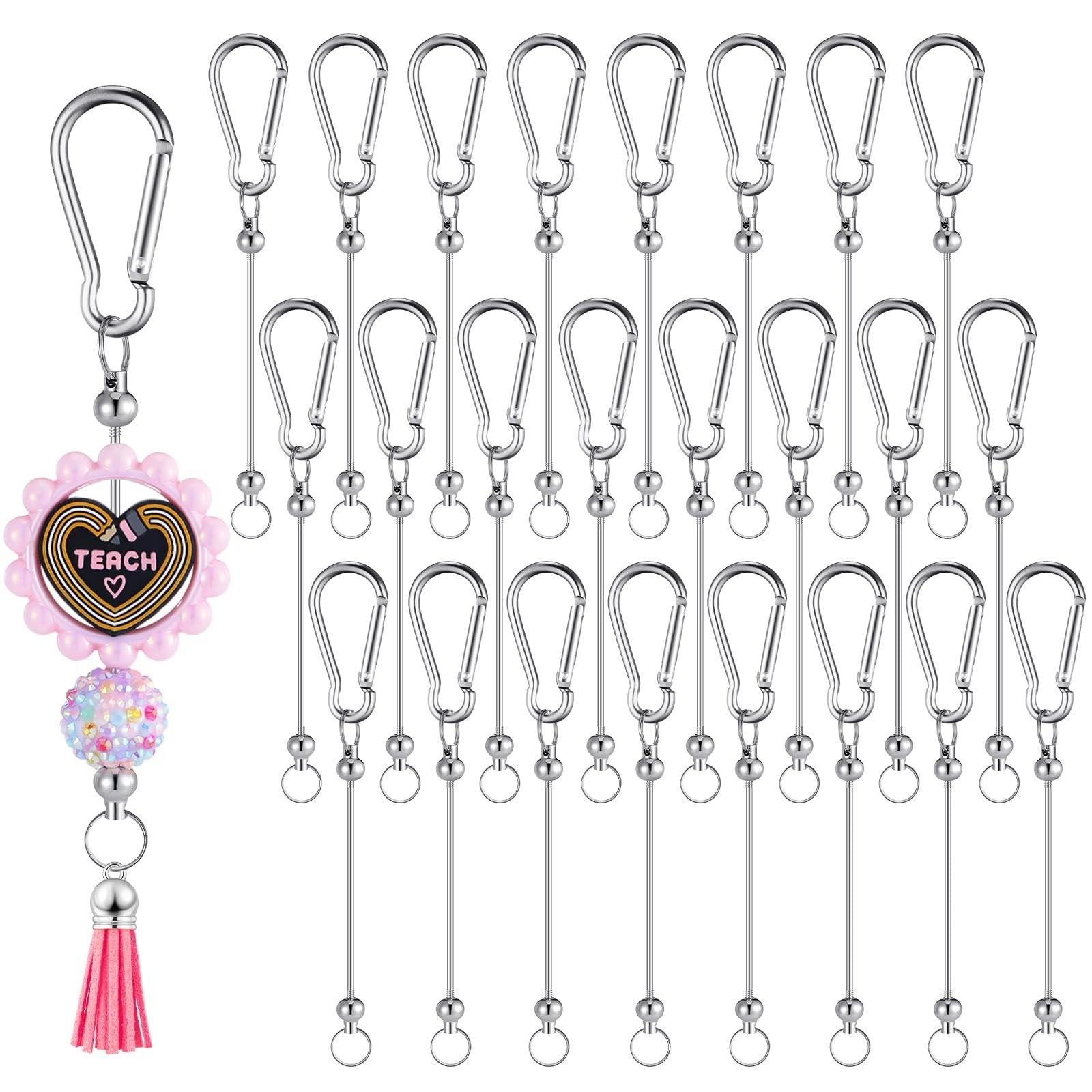 Silver metal keychain bars with snap hooks and one decorative keychain with 'TEACH' text and pink tassel