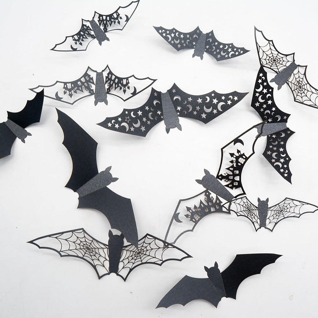 Assortment of black 3D vinyl Halloween bat wall stickers with various cut-out designs like spiderwebs and moons, arranged on a white background.