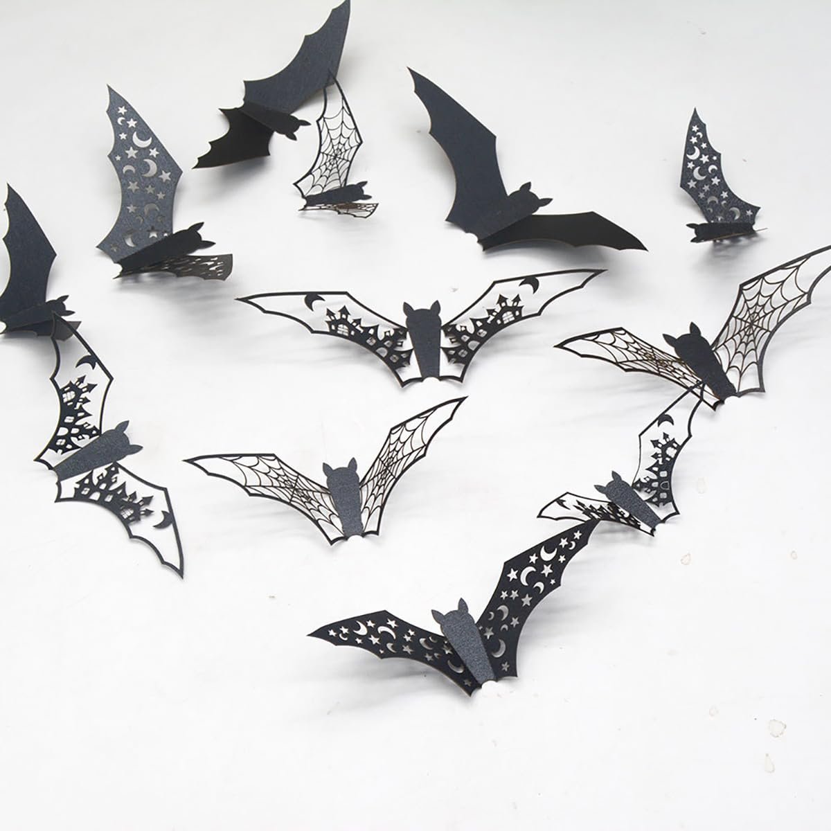 Collection of black 3D Halloween bat wall stickers with intricate cutouts and patterns, arranged on a white background.