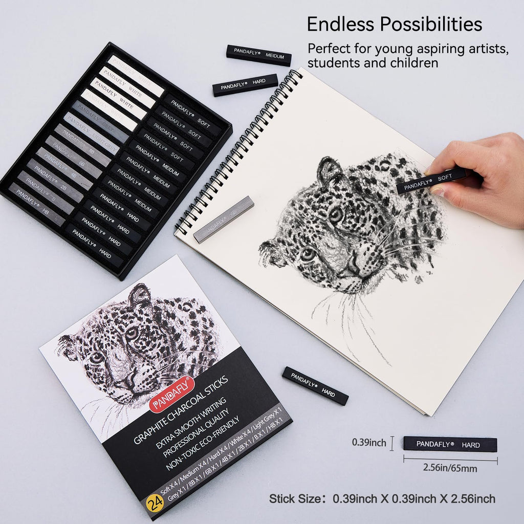 Drawing sticks set with charcoal sticks and graphite pencils on a sketchbook with a leopard drawing. A hand holds a charcoal stick.