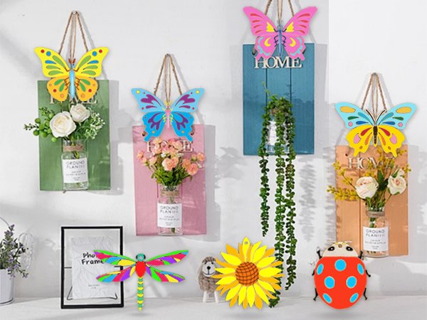 Assortment of colorful wooden spring-themed craft decorations including butterflies, a ladybug, a sunflower, and a dragonfly.