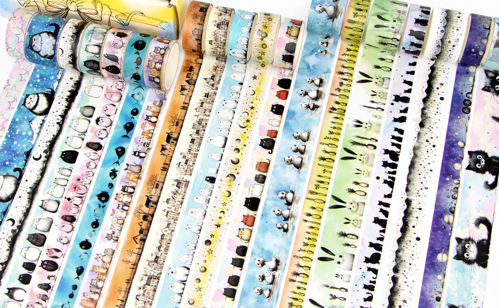 Collection of decorative washi tape rolls with various kawaii animal and nature designs, fanned out.