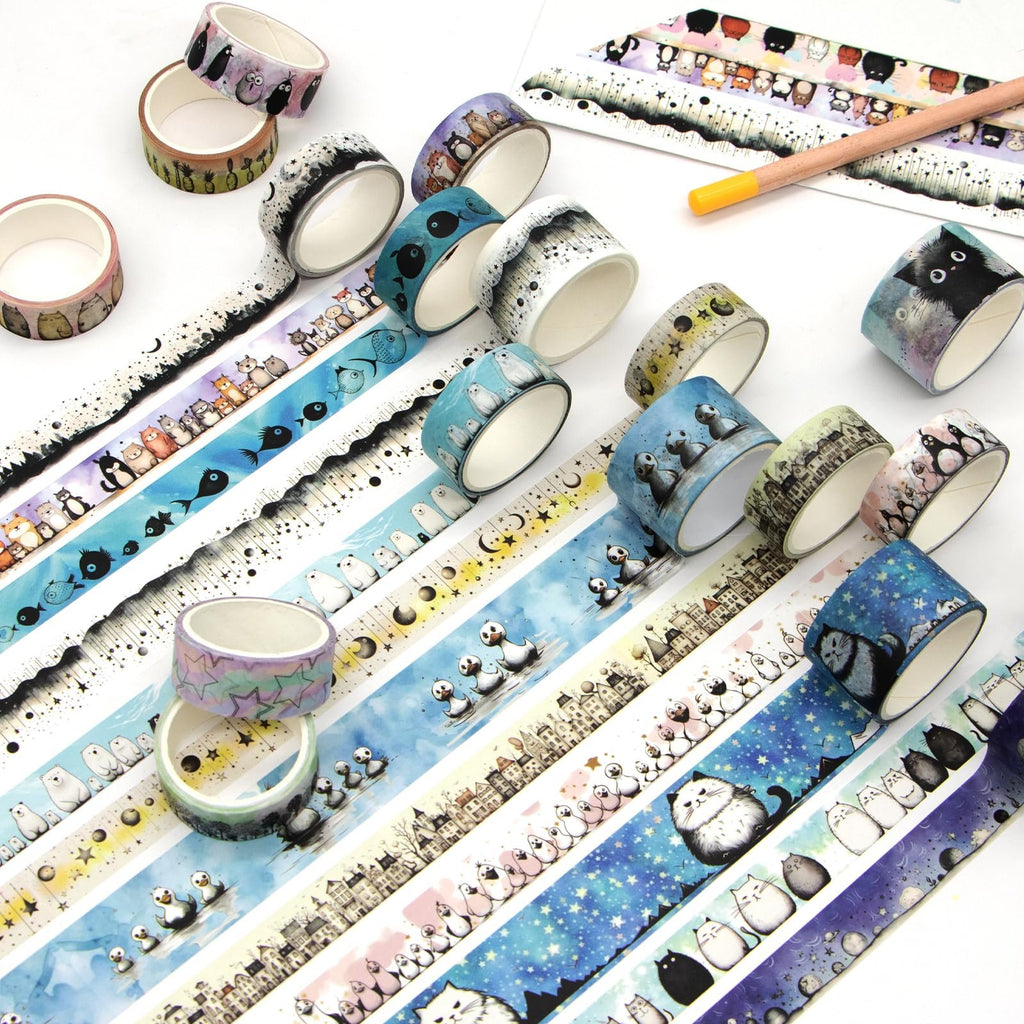 Assortment of kawaii animal washi tape rolls and unwound tape featuring cats, penguins, and bears.