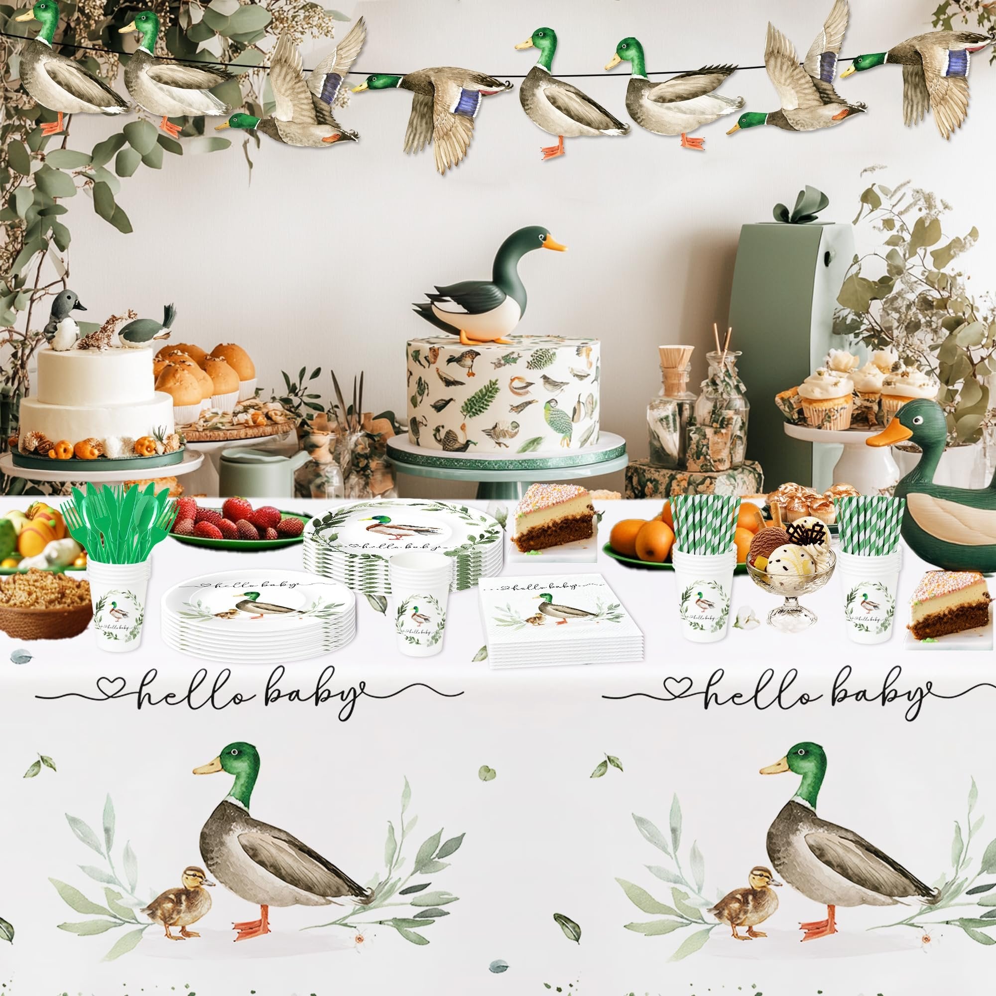 Mallard duck themed baby shower party supplies laid out on a table with cake and desserts.