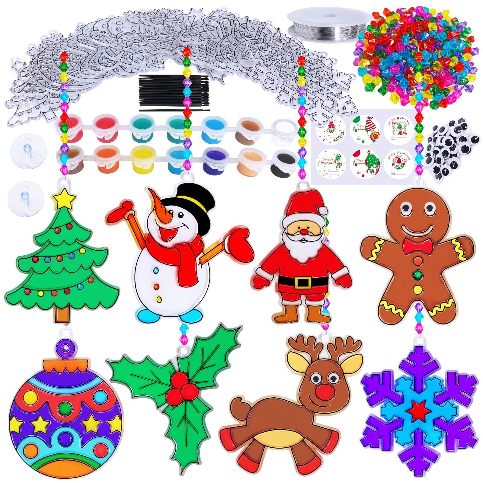 Christmas suncatcher craft kit contents including paint, beads, string, and various acrylic shapes like a tree, snowman, Santa, gingerbread man, ornament, holly, reindeer, and snowflake.