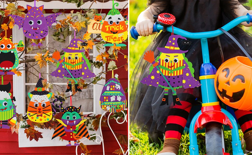Halloween foam ornament craft kits hanging on branches and attached to a bicycle