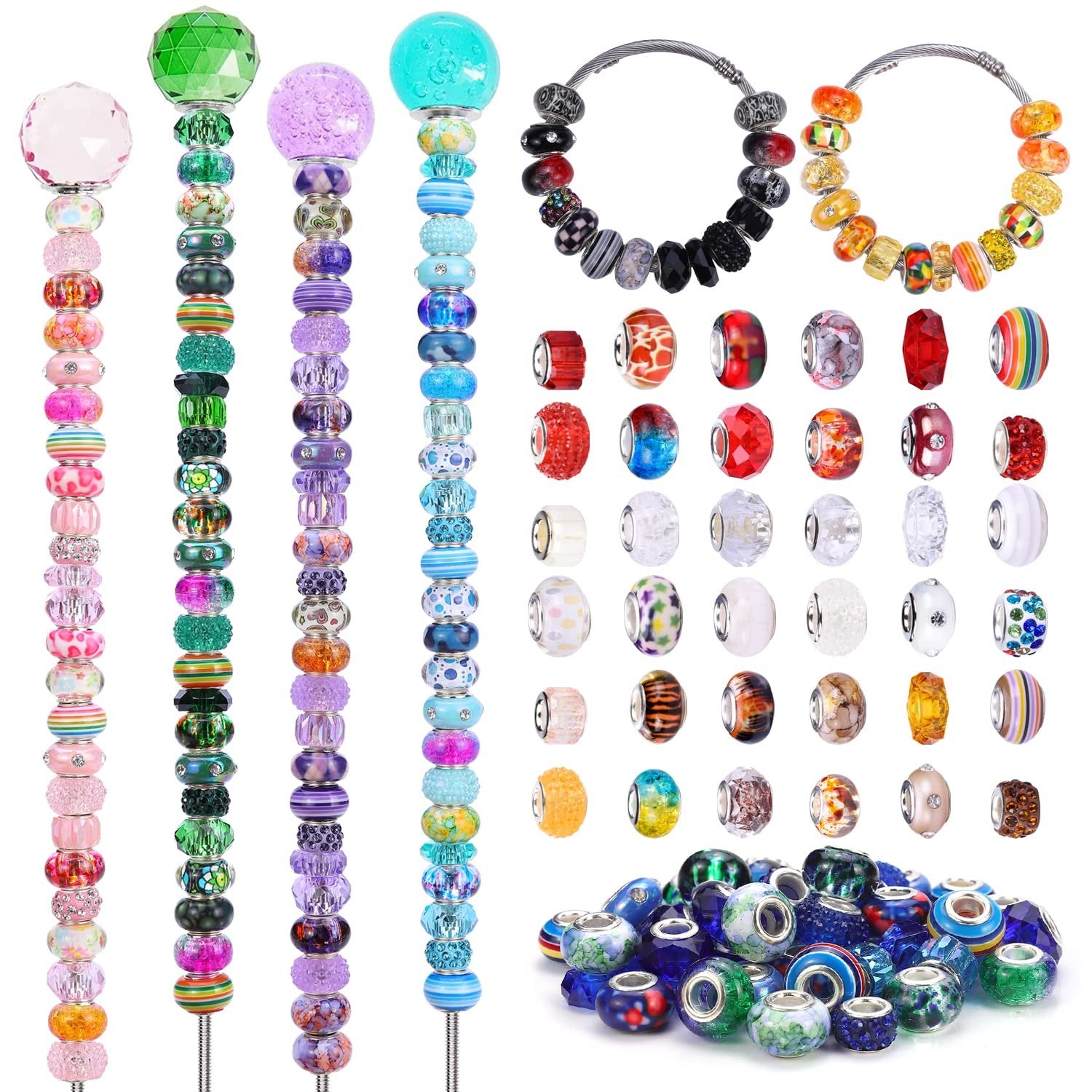 Assortment of colorful lampwork spacer beads in various shapes and sizes, displayed on rods and in a pile.