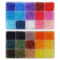 Two clear plastic organizer boxes filled with 6mm faceted acrylic bicone beads in 30 assorted colors for jewelry making.