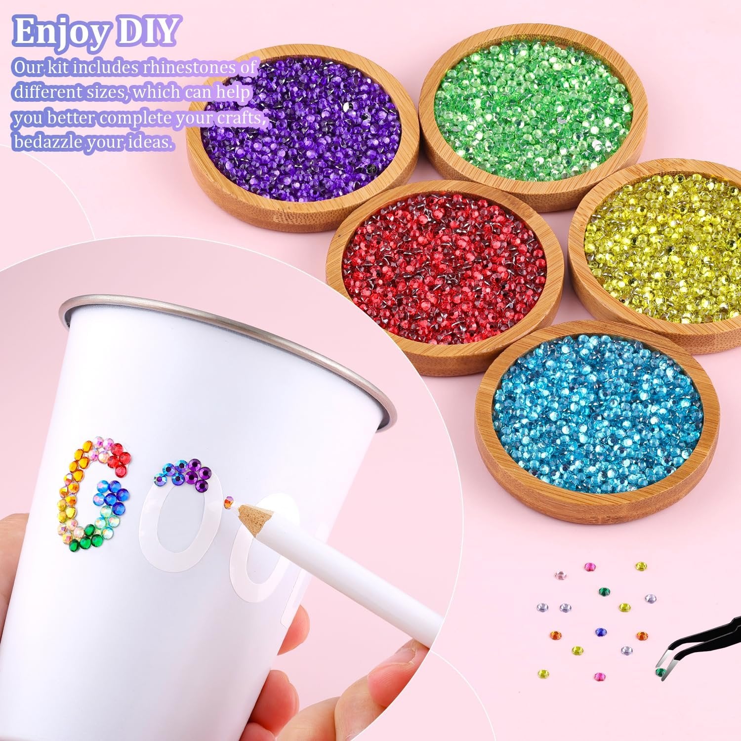 Hand decorating a white cup with colorful rhinestones using a pickup pen, with bowls of rhinestones in the background.