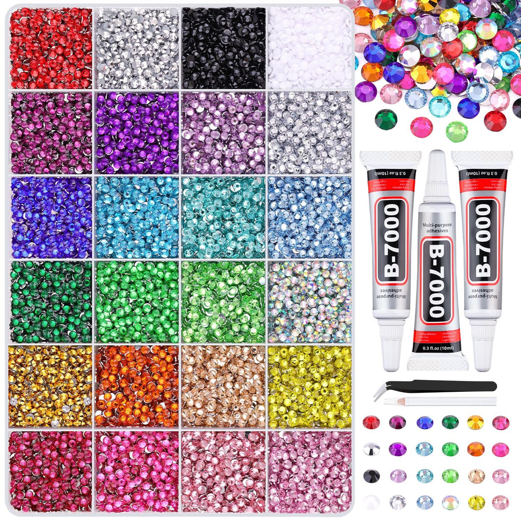 Assorted colorful rhinestones in divided compartments with tubes of B-7000 glue and tweezers.
