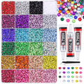 Assorted colorful rhinestones in divided compartments with tubes of B-7000 glue and tweezers.