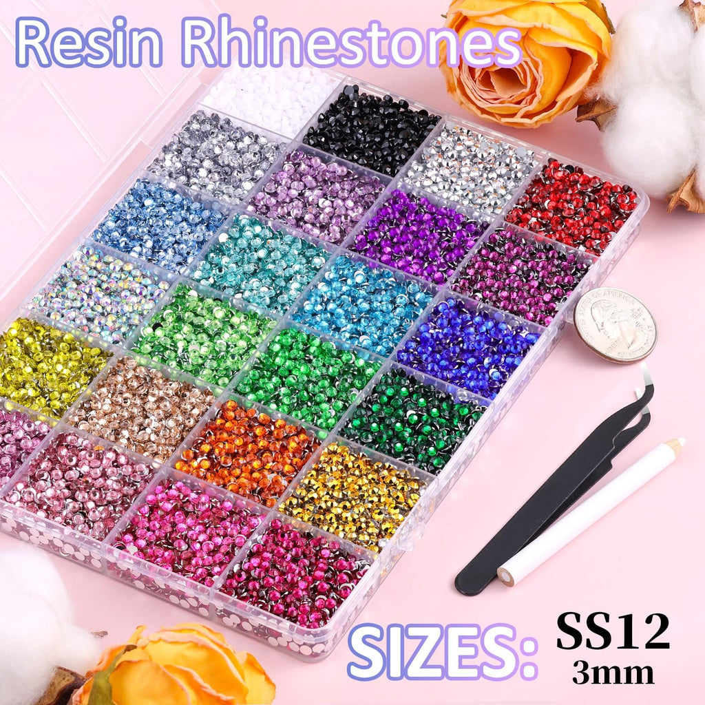 Assorted resin rhinestones in a divided organizer case with tweezers and a pickup pen, featuring multiple colors.