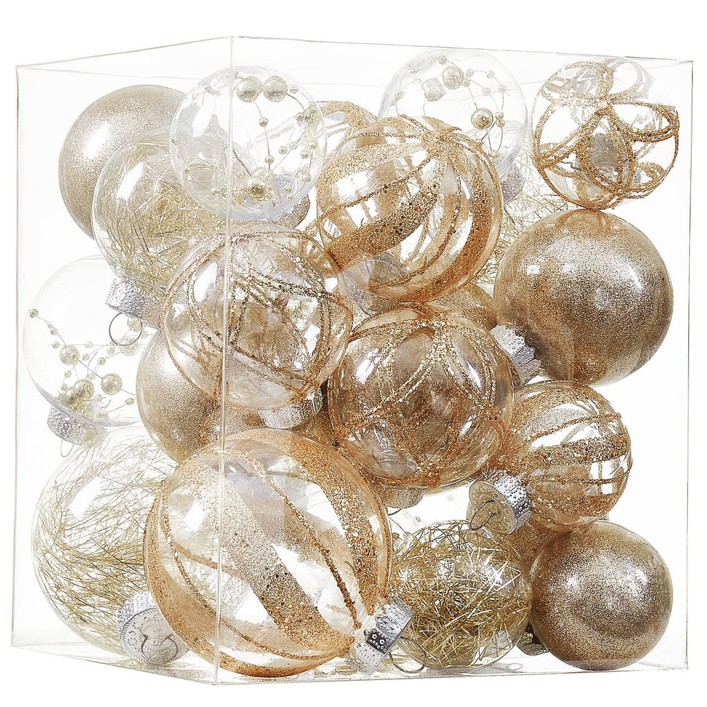 Clear plastic Christmas ball ornaments in champagne gold glitter fill, arranged in a clear box.