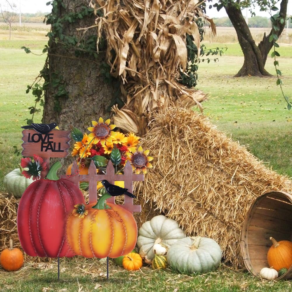 Decorative metal fall garden stakes with pumpkins, sunflowers, crows, and 'I LOVE FALL' sign in a yard setting.