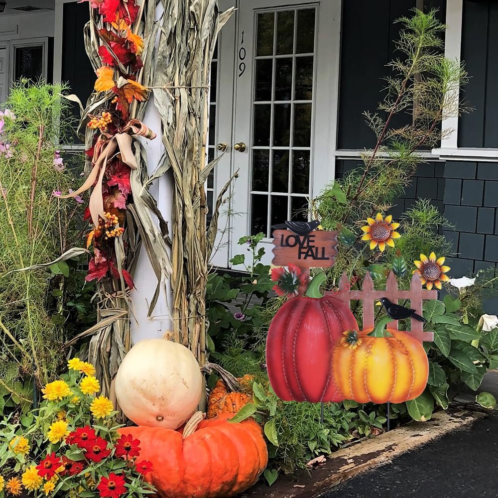 Fall garden stakes with pumpkins, sunflowers, crows, and 'I LOVE FALL' sign displayed outdoors.