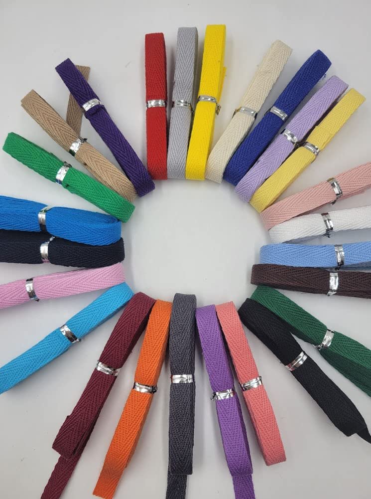 Assortment of 3/8 inch cotton twill tape in various colors arranged in a circle