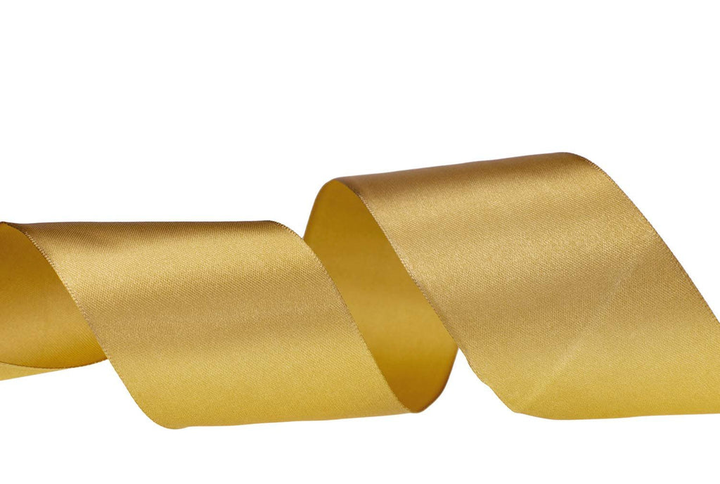 A roll of dark gold satin ribbon is shown in a flowing curve against a white background.