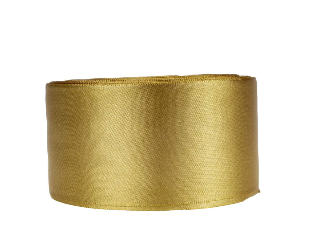 Roll of dark gold satin ribbon on a white background, showing the textured surface and edge stitching.