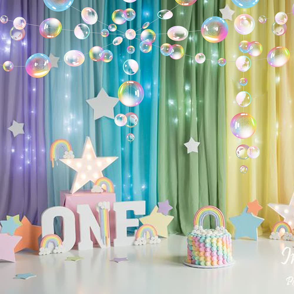 Transparent bubble garland with 80 PVC bubbles, displayed at a party with a cake and 'ONE' letters.