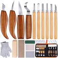 Wood carving kit with various knives, gloves, sharpening stones, wood blanks, and a storage case.