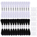 26 skeins of black and white embroidery floss with 10 plastic bobbins arranged on a white background.