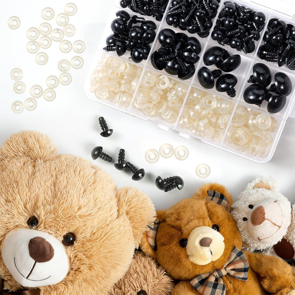 Set of black safety eyes and clear washers for crafts, arranged with plush teddy bears on a white background.