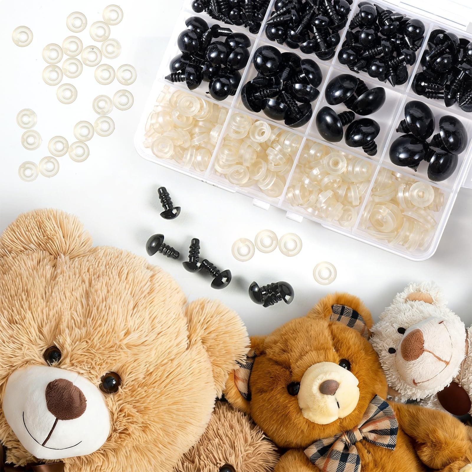 Set of black safety eyes and clear washers for crafts, arranged with plush teddy bears on a white background.