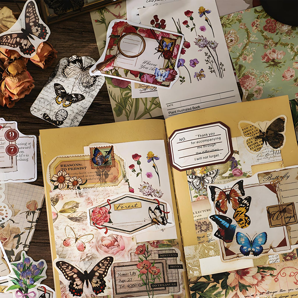 Scrapbooking supplies kit with vintage flowers and butterflies, including papers, stickers, and hangtags.