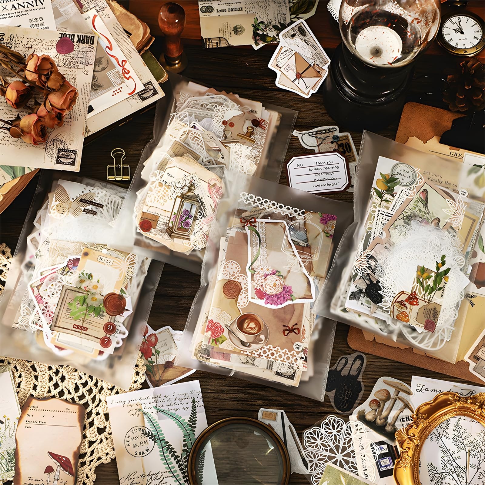 Flat lay of vintage scrapbooking supplies including papers, stickers, and washi tape on a wooden surface.