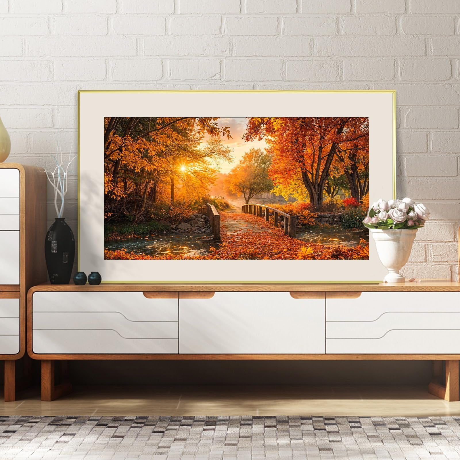 Framed diamond painting of a forest bridge over a stream during autumn with golden sunlight.