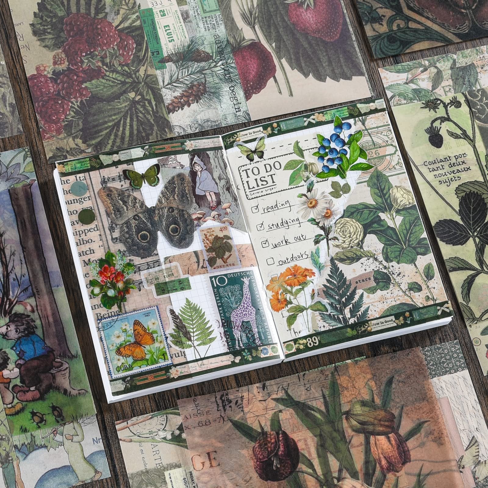 Scrapbooking kit contents laid out, featuring a notebook with a to-do list, butterflies, flowers, and vintage ephemera.
