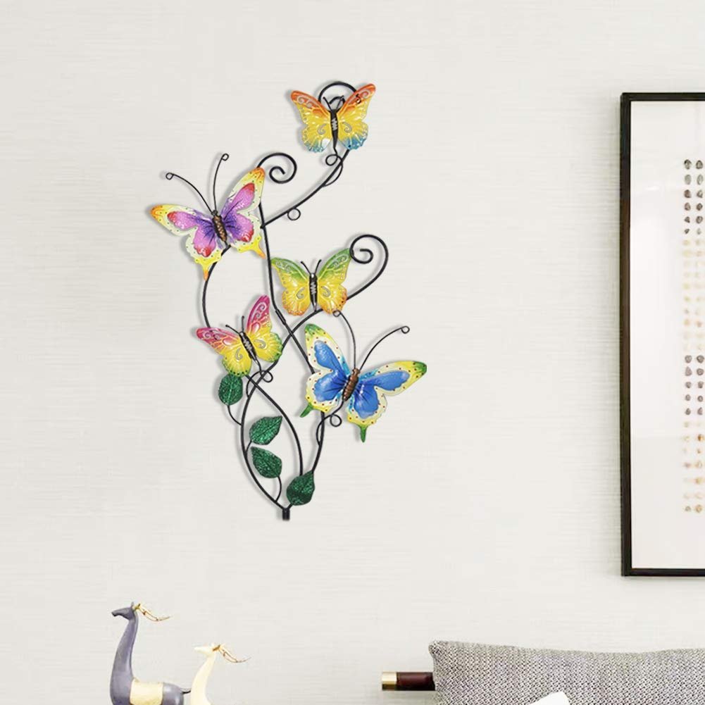 Metal butterfly wall art with five colorful butterflies on a vine, displayed on a white wall.
