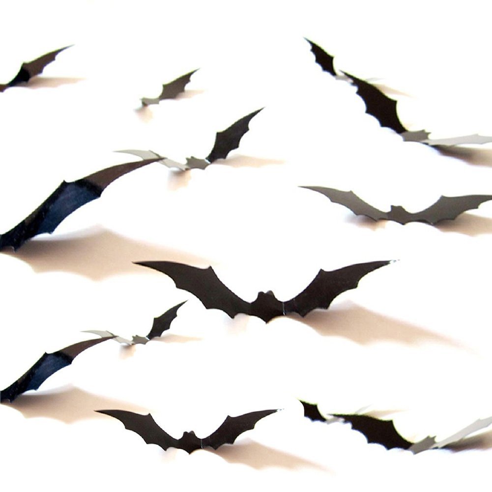 Assorted black PVC 3D bat wall decals scattered across a white background, casting shadows.