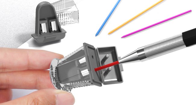 Close-up of a hand holding a mechanical pencil sharpener with lead being inserted.