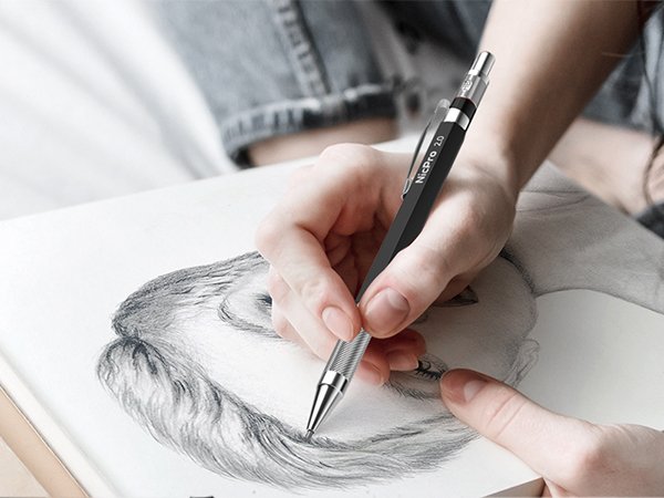 Hand holding a black mechanical pencil with ' 2.0' text, drawing on a sketchpad.