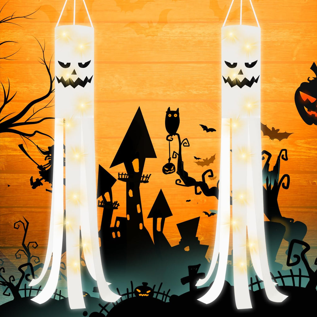 Two white Halloween ghost windsocks with LED lights and spooky faces hang against an orange wooden background with Halloween graphics.