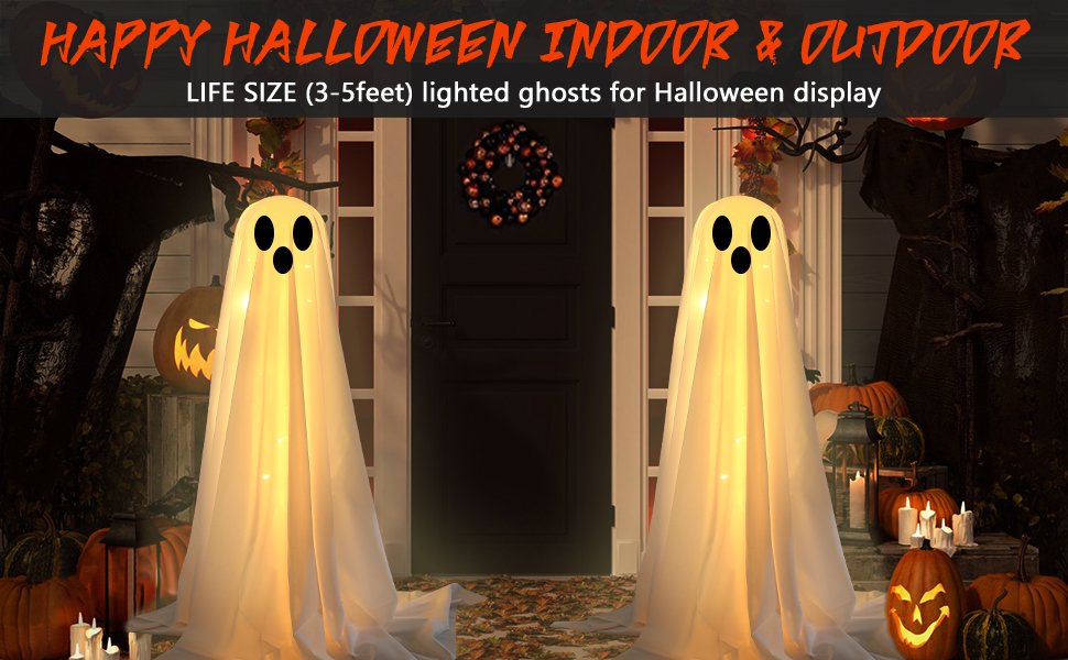 Two large lighted white cloth ghosts with string lights displayed on a porch with pumpkins and fall leaves for Halloween.