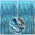 Pale blue foil fringe curtain backdrop with a close-up inset showing wavy tinsel streamers.