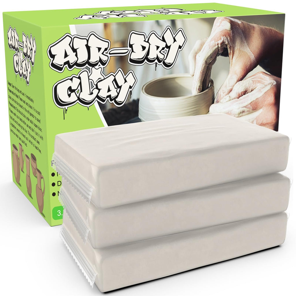 Three blocks of white air-dry clay stacked, with a box showing hands working clay in the background.