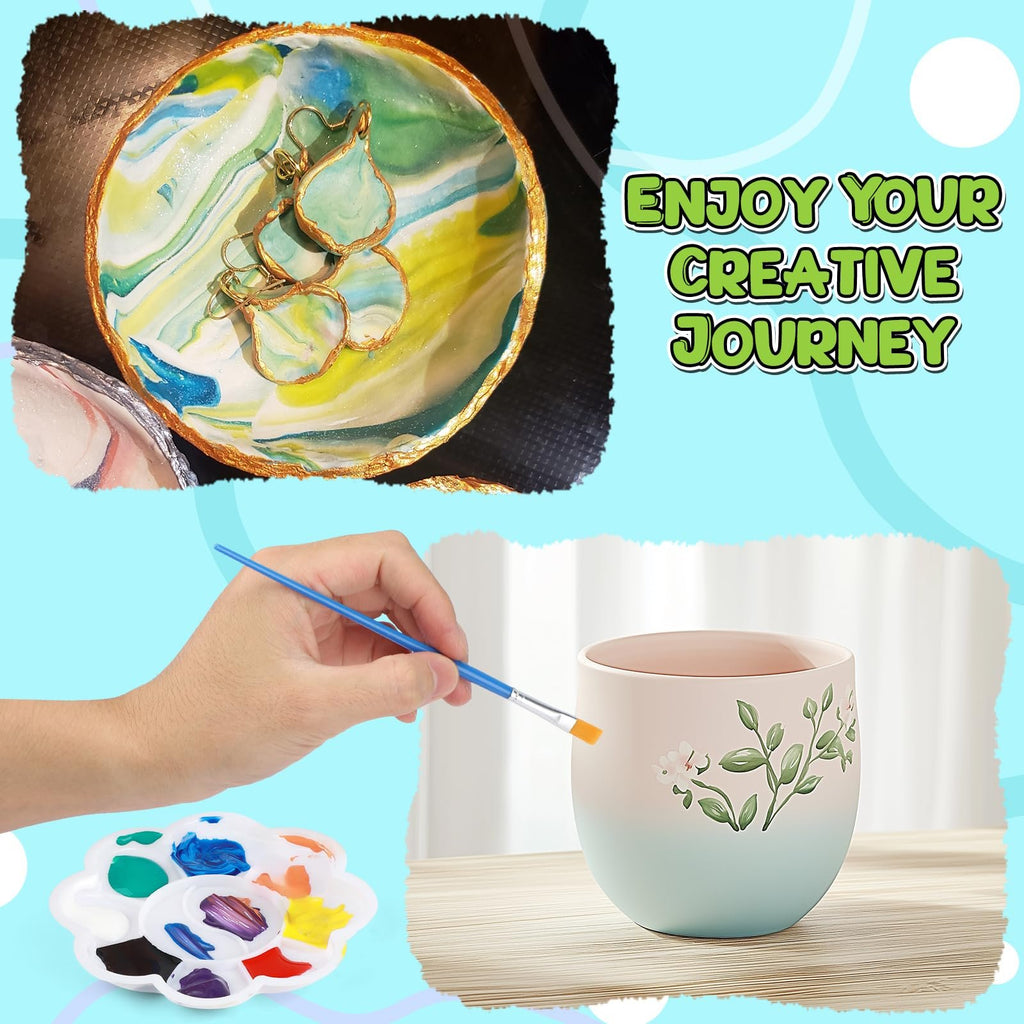 Hand painting a decorative mug with a brush and paint palette, next to a marbled clay dish with jewelry.