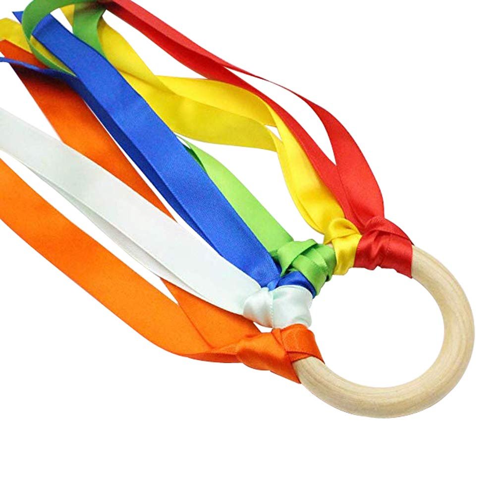 Wooden ring with colorful satin ribbons attached, close-up shot on white background.