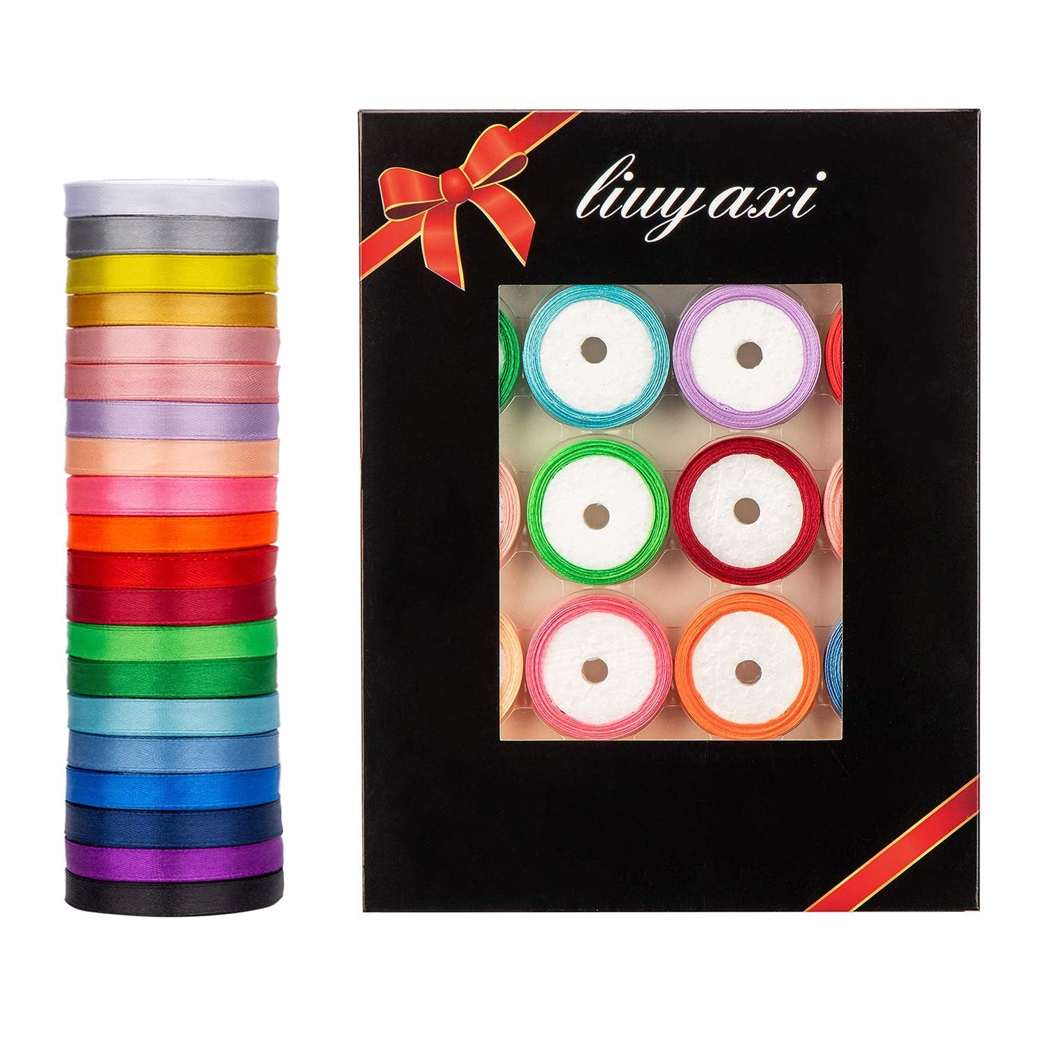 Stack of colorful satin ribbon rolls next to a black box displaying more ribbon rolls