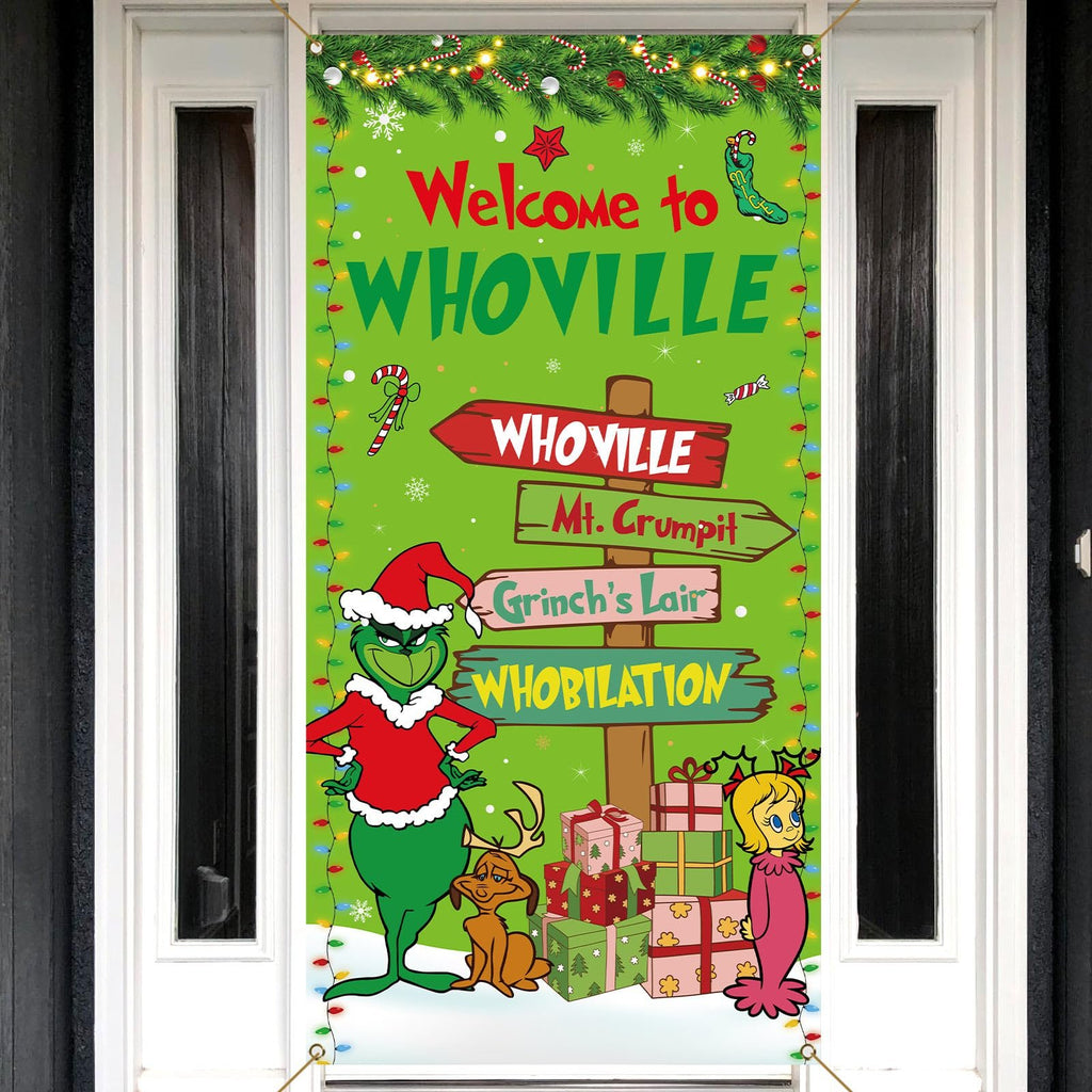 Christmas banner with Grinch characters and Whoville signs hanging on a door