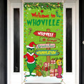 Christmas banner with Grinch characters and Whoville signs hanging on a door