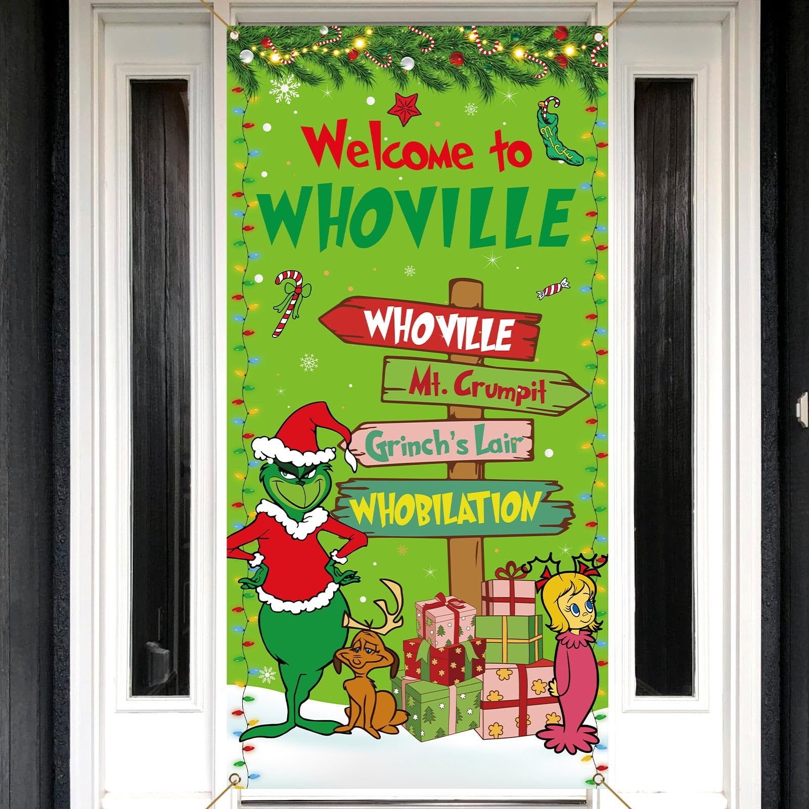 Christmas banner with Grinch characters and Whoville signs hanging on a door