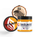 Jar of wood burning paste with a wood slice featuring an American flag design and a circular logo.