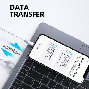 Lightning cable connected to a smartphone on a laptop keyboard, showing data transfer.