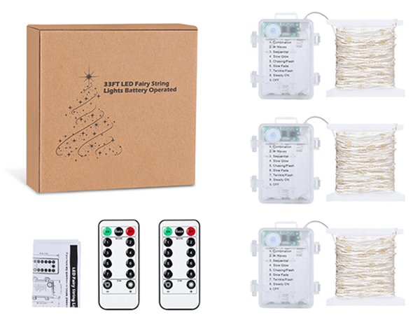 Three spools of warm white fairy string lights with battery packs and two remote controls, next to a cardboard box.