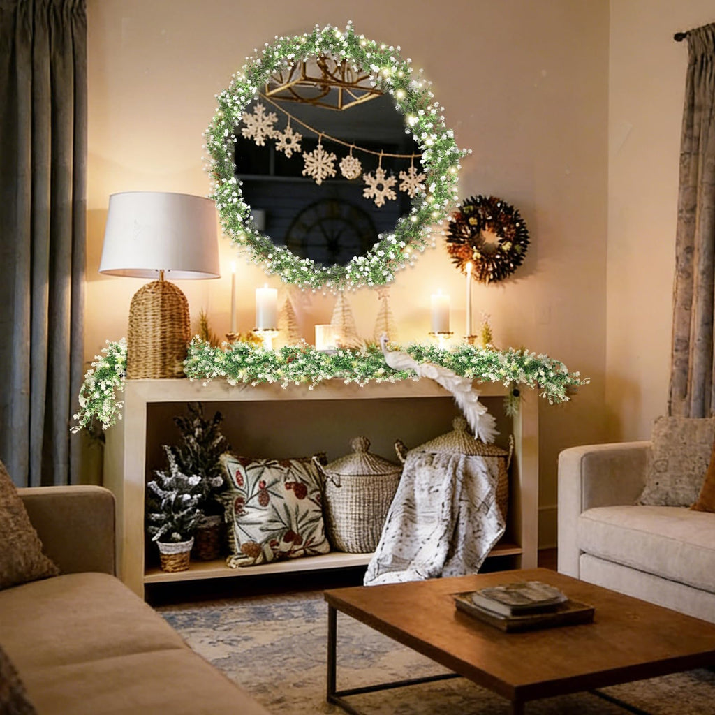 Christmas garland with LED lights draped over a mantelpiece with a mirror and snowflakes above