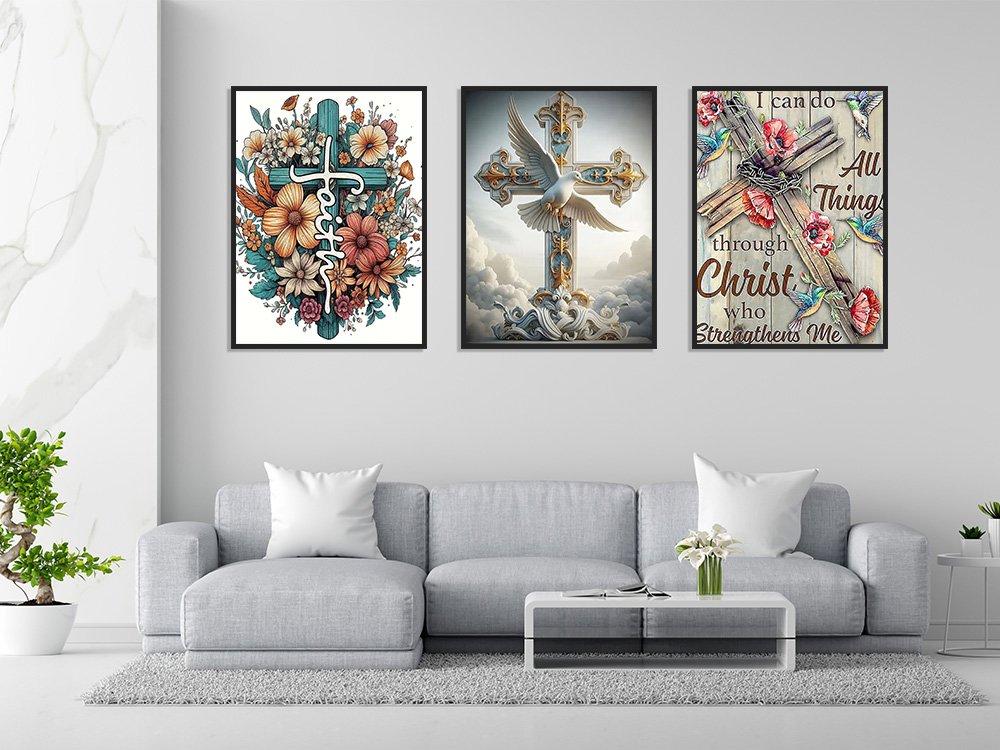 Three framed religious cross art prints displayed on a wall above a sofa.